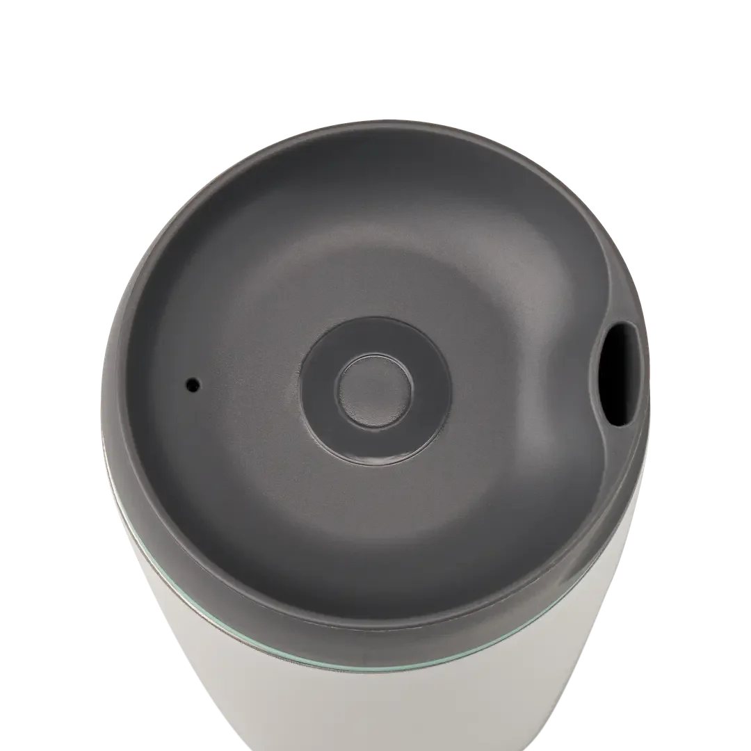 Owala SmoothSip 12oz in white body with gray lid and mint green accent ring, top view